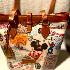 Questions? Leave A Comment Below! Brown Disney Bags For Everyday Use, Disney Style Brown Bag For Everyday Use, Disney Everyday Brown Bags, Disney Style Shoulder Bag For Travel, Disney Brown Travel Bags, Disney Style Brown Travel Bag, Dooney And Bourke Disney, Disney Dooney, Retro Handbags