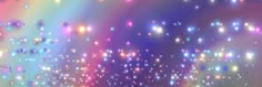 an image of a rainbow colored background with stars and sparkles in the sky,