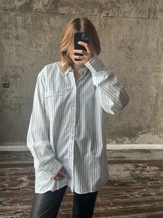 Vintage oversized striped shirt in green and white, long-sleeved, button-up closure, gender neutral, 55% cotton and 45% polyester, loose and light fit, fits sizes XS-L, perfect vintage condition. Measurements: Shoulders 50 cm / 19.6" Sleeve 65 cm / 25.5" Length 80 cm / 31.4" Bust from armpit to armpit 61 cm / 24" White Long Sleeve Shirt With Vertical Stripes, Oversized Striped Shirt For Daywear, Oversized Pinstripe Long Sleeve Shirt, Classic Oversized Shirt With Striped Collar, Oversized White Shirt With Striped Collar, Oversized Classic Tops With Vertical Stripes, Oversized Long Sleeve Shirt With Striped Collar, White Relaxed Fit Shirt With Vertical Stripes, Oversized Cotton Shirt With Striped Collar