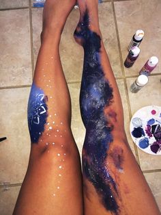 the legs are covered in blue and purple paint