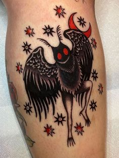 a woman's thigh with a rooster tattoo on it and stars around the thighs