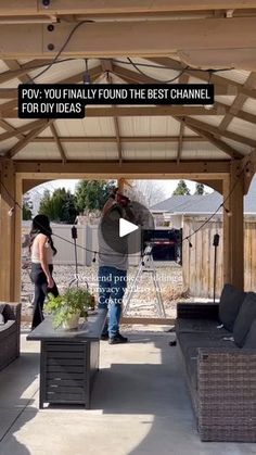 an outdoor living area with couches and tables