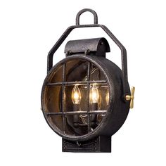 an old fashioned light fixture with three bulbs