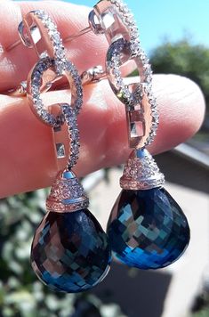 ATTENTION BUYERS.. PLEASE READ ANNOUNCEMENT IN MY SHOP. it's very important information there about purchasing items. Must purchase thru Etsy only, NOT from " Offsite ads"Absolutely Stunning 18k White Gold, Diamond, Huge Briolette Blue Topaz dangle Earrings... Weight is Approximately 26 Grams. All sales are final no return. Some pics enlarged to see details. Exclusive, One Of A Kind... Not Flat, 3D.... Absolutely Fabulous, look Spectacular... Mannequin is Real Life Size.. Earrings is absolutely stunning, stone are clean and Bright..and TRANSPARENT Look spectacular..ATTENTION BUYERS ALL ITEMS FROM MY SHOP MUST BE PURCHASED STRAIGHT FROM ETSY, NOT FROM OFFSITE ADDS  All orders purchasing from Google and others will be cancelled  NOT SELLING TO BUYERS THRU  ETSY APP  Etsy charging me $100 ext Absolutely Fabulous, Life Size, Blue Topaz, Gold Diamond, Jewelry Earrings Dangle, Topaz, Real Life, Diamond Earrings, Dangle Drop Earrings