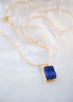 18kt Gold Filled Necklace featuring a starry Lapis Lazuli slice gemstone plated in gold. Dignified Lapis Lazuli encourages self-awareness, allows self-expression and reveals inner truth, providing qualities of honesty, compassion and morality to the personality. It also promotes stronger self confidence and strengthens credibility. Arm yourself with this favorite gold gemstone necklace. ✦ DETAILS ✦✧ Name: Ku (koo) - To stand.✧ Gold plated Lapis Lazuli gemstone - naturally cut slices mean every p Delicate Gold Bracelet, Gold Gemstone Necklace, Lapis Lazuli Gemstone, Gold Filled Necklace, Gold Charm Necklace, Gold Filled Earrings, Shell Necklaces, Self Awareness, Minimalist Necklace