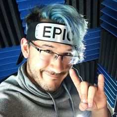 a man with blue hair wearing a headband that says epil on it's forehead