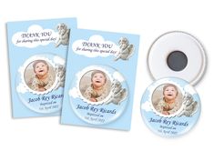 two cd's with a photo of a baby in the clouds on them, and a thank you card next to it