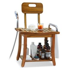 a wooden chair with soap, lotion and other items sitting on top of it