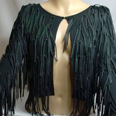 Deep Black Tassel Sweater Cardigan Nwot. Never Worn Size S. 100% Rayon. Shoulder 15, Bust 15, Length 14.5, Sleeve 25, Bicep 5.5. Measured In Inches Laying Flat. Elegant Fall Fringe Tops, Elegant Fringe Tops For Fall, Fitted Fringe Outerwear For Parties, Fitted Party Outerwear With Fringe, Evening Fringe Tops For Fall, Fitted Long Sleeve Top With Fringe, Fitted Fringe Tops For Evening, Fitted Black Outerwear With Fringe, Fitted Black Fringe Outerwear