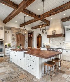 a large kitchen with an island in the middle