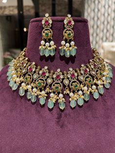 jadau Polki kundan Ad Cz Bridal choker set with Jhumki/ Sabyasachi inspired choker/Real pachi kundan Necklace/ Sabyasachi wedding jewelry.Easy to wear, Light in weight & gives you a classy Look. It can be wear in festival occasion with matching salwar or saree. All the raw material used in this product is of high quality and is handcrafted with love. Partywear sabyasachi style Heavy Bridal Jewelry Set Product Details: Type: Choker Color: Golden color Size: Adjustable Thread Occasion: Festival, W Heavy Bollywood Style Jhumkas For Designer Wear, Heavy Bollywood Jhumkas For Designer Wear, Bollywood Style Lehenga For Reception, Bollywood Style Festive Jewelry Sets For Designer Wear, Festive Kundan Hand Set Choker, Festive Bollywood Designer Jewelry Sets, Festive Kundan Choker With Hand Set Details, Bollywood Style Kundan Temple Necklace, Kundan Temple Jewelry Set For Reception