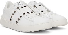 Low-top buffed calfskin sneakers in white. Signature pyramid studs at sides. · Partially concealed lace-up closure · Logo flag at padded tongue · Padded collar · Rubberized signature pyramid studs at heel counter · Treaded rubber sole · Gunmetal-tone hardware Supplier color: White Pyramid, Valentino Garavani, Low Top, Calf Skin, Rubber Sole, Color White, Women Wear, Flag, Lace Up