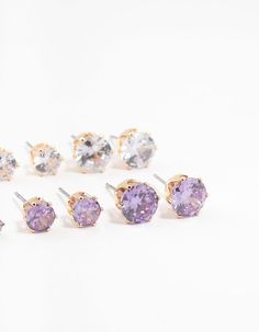 Polish off your look with this sparkling 6-pack of gold-toned stud earrings featuring a captivating blend of silver and purple cubic zirconia gems. Wear them solo for a sophisticated accent or layer them for a dazzling display. Material: Cubic Zirconia Color: Silver & Purple Dimensions: Length 8 mm x Width 9 mm Smallest Earring Length 3 mm x Smallest Earring Width 4 mm | Lovisa Gold Round Silver & Purple Cubic Zirconia Stud Earrings 6-Pack Small Earrings, 6 Packs, 6 Pack, Cubic Zirconia, Sparkle, Gems, Stud Earrings, Purple, Silver