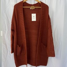 Boutique Winter Sale! Open Front Cardigan Sweater With Pockets. Is Red/Orange In Color, Super Comfortable! Size Large Burnt Orange Long Sleeve Winter Sweater, Casual Burnt Orange Sweater For Fall, Cozy Orange Outerwear For Spring, Orange Long Sleeve One Size Cardigan, Orange V-neck Outerwear For Fall, One Size Orange Long Sleeve Cardigan, Oversized Orange Winter Cardigan, Orange Knit Long Sleeve Outerwear, Oversized Orange Cardigan For Winter