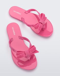 Step into summer with Mini Melissa Harmonic M Lover flip flops. The delicate bow, adorned with the iconic Melissa logo adds a romantic touch to this timeless silhouette. These are ultra-lightweight and practical, making them the perfect choice for every warm-weather outfit. Plus, you can match your mini!