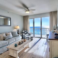 a living room filled with furniture and a flat screen tv