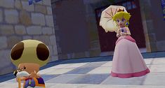 the nintendo wii game mario kart is playing with her doll and mushroom character in front of