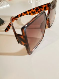 Vintage lightweight oversized square leopard print framed sunglasses.

2-day processing. Shipped in 4-7 days. Oversized Square Sunglasses, Reflective Material, Mini Handbags, Eyeglass Case, Sunglass Frames, Summer Casual, Square Sunglasses, Leopard Print, Sunglasses