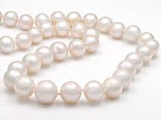 10-13mm White Cultured Freshwater Pearl Rhodium Over Sterling Silver 20" Necklace. Measures approximately 9/16 of an inch in width and has a bead clasp. Colors, shapes, and sizes may vary. Classic White Jewelry With Polished Beads, White High Luster Round Bead Necklaces, White High Luster Round Beaded Necklaces, White High Luster Round Beads Necklace, White Polished Pearl Necklace For Formal Occasions, Classic Round Pearl Necklace With Polished Beads, Classic Polished Beads Pearl Necklace, Classic White Polished Beads Necklaces, Classic White Necklaces With Polished Beads