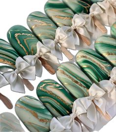 several green and white decorated cookies with bows