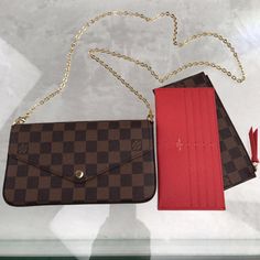 The Pochette Felicie in Damier Ebene canvas is a versatile pouch for modern lifestyles. Its envelope-style flap opens to reveal a spacious compartment with two removable pockets: one zipped, another with several card slots. It can be carried on the shoulder or across the body, or - with the chain removed - as a clutch.8.3 x 4.7 x 1.2 inches(length x Height x Width)Damier ebene coated canvas and cowhide leatherDamier ebene coated-canvas and cowhide-leather trimTextile liningGold-color hardwarePress-stud closureLarge compartmentRemovable zipped pocketRemovable flat pocket with 8 card slotsInside flat pocket LV Felicie Pochette come with dust bag.Delivery 5-8 or 10-15 working days Please note that during high season and Sale period, delivery times may be affected We accept payment with a Cred Lv Felicie Pochette, Lv Damier Ebene, Felicie Pochette, Pochette Felicie, Lv Damier, Louis Vuitton Damier Ebene, Damier Ebene, Modern Lifestyle, Cowhide Leather