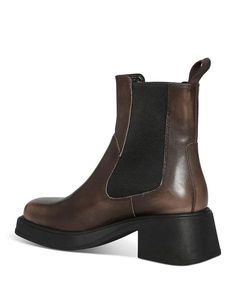 Make a stylish and effortless statement wherever you go in the Dorah Pull On Chelsea Boots. Featuring a classic pointed-toe silhouette and comfortable pull tab, these boots fit true-to-size and feature a supportive 2.32' heel for all-day wear. The leather upper and fabric lining combine sophistication with breathability, while the durable TPR sole provides traction. Perfect for dressing up or down any outfit from work to weekends, this Chelsea boot is your new go-to for fashionable comfort and v Brown Chelsea Boots With Square Toe, Brown Square Toe Chelsea Boots With Leather Sole, Fall Chelsea Boots With Lug Sole And Square Toe, Fall Chelsea Boots With Square Toe And Leather Lining, Brown Square Toe Chelsea Boots For Winter, Fall Boots With Leather Footbed And Square Toe, Boots Fit, Chelsea Boot, Pull Tab