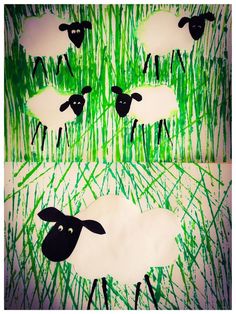 the sheep are standing in the tall grass with their faces drawn on paper and then cut out to look like they're looking at something