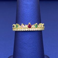 A beautiful combination of vibrant cubic zirconia stones in this crown ring. This ring is available in 10k yellow gold. Metal: 10k GoldStone: Cubic ZirconiaType: RingSize: 7 West Indian Bangles, Picture Pendant, Women's Rings, Color Stones, Crown Ring, Name Jewelry, Solid Gold Rings, Gold Stone, Stone Gold