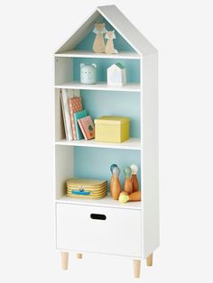 a white bookcase with shelves and toys on top