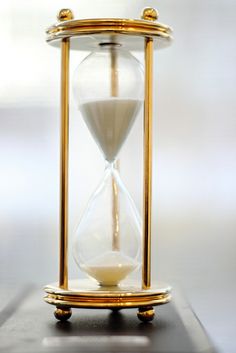 an hourglass sitting on top of a table