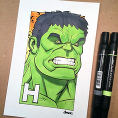 a drawing of the incredible hulk in color and marker pen next to it on a piece of paper