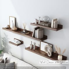 three shelves with books, vases and other items on them in a living room