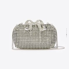 Elevate Your Evening Look With This Stunning Self-Portrait Silver Chainmail Clutch Bag. The Sleek Design Is Perfect For A Night Out, While The Rhinestone Exterior Adds A Touch Of Glamour To Any Outfit. The Clutch Is Crafted In A Silver Tone, And The Chainmail Detail Is Sure To Catch Everyone's Eye. With A Brand Name Like Self-Portrait, You Can Be Sure That This Clutch Is Made With The Highest Quality Materials. The Bag Is Perfect For Any Woman Who Wants To Add A Touch Of Elegance To Her Wardrobe Silver Evening Bag With Chain, Luxury Chain Bag For Events, Formal Silver Bag With Chain, Elegant Silver Chain Link Bag, Silver Evening Bag With Chain Detail, Elegant Silver Bag With Chainmail Detail, Elegant Silver Bag With Chain, Silver Evening Bags With Chain, Elegant Silver Bags With Chain Detail