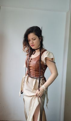 Unique quality real calf leather is used.  With its historical texture, it is a vest bodice that you will enjoy using at costume parties, renaissance fairs, concerts or in your daily life. Ajdustable size with 3 elevator with eyelets.  Ready to shipping  Worldwide free express shipping is used Any size avaliable . Please message me your bust, waist and height measurements ++  Customs and import taxes that may occur in customers country are the customer's responsibility. Witcher Outfits Female, Bohemian Medieval Dress For Medieval Festivals, Bohemian Medieval Dress For Festival, Bohemian Style Fitted Medieval Dress For Cosplay, Bohemian Medieval Dress For Cosplay And Medieval Festivals, Bohemian Fitted Medieval Dress For Cosplay, Steampunk Corset Belt For Fantasy Events, Bohemian Medieval Dress For Cosplay And Festivals, Viking Style Cosplay Costume For Events