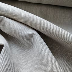 the fabric is white and grey in color