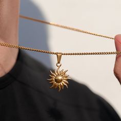 A stunning statement piece, our Sun Pendant Necklace is a classic yet modern addition to any jewelry collection. Made from 316L stainless steel, it is an expression of enduring sophistication and style. Durable, water, and sweat-proof, this necklace is the perfect iconic symbol. This chain can be worn on its own as a statement or be layered with other chains from our shop.◈ Chain Length: 20.8 Inches◈ Chain Width: 2.2 MM◈ Chain Style: Curb chain◈ Pendant Size: 22mm x 19mm x 2.3mm��◈ Chain Quality: Sun Pendant Gold, Gold Pendants For Men, Modern Addition, Sun Pendant, Gold Rope Chains, Gold Sun, Mens Pendant, Sweat Proof, Chain Pendant