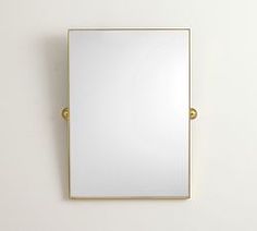 a mirror mounted to the side of a wall