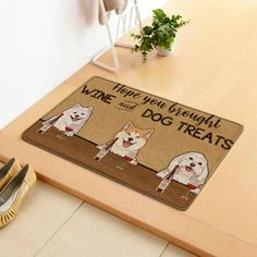 there is a door mat with dogs on it