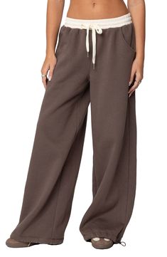 Cozy and cool, these sweatpants feature a relaxed, slouchy fit with wide legs, a contrasting low-rise waist and a soft cotton-blend fabrication that'll keep you ultracomfy. Elastic/drawstring waist Front scoop pockets 50% cotton, 50% polyester Machine wash, dry flat Imported Brandy Wide Leg Sweatpants, Cute Sweat Pants, Hanes Sweatpants, North Face Sweatpants, Wide Leg Sweat Pants, Low Rise Sweatpants, Desired Wardrobe, Cute Sweats, College Wardrobe