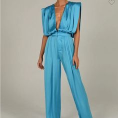 Size Small Blue Satin Blue Summer Pantsuit For Party, Blue Pantsuit For Summer Party, Chic Light Blue V-neck Jumpsuit, Light Blue V-neck Jumpsuit For Party, Blue Bottoms For Summer Evenings, Blue Bottoms For Summer Evening, Chic Blue Jumpsuits And Rompers For Party, Sleeveless Blue Pantsuit For Summer, Chic Light Blue V-neck Jumpsuits And Rompers