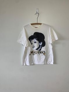 Vintage 1993 Madonna The Girlie Show front and back print tour t-shirt. Such a great graphic. Copyright dated. Single stitch. One of the more iconic Madonna tours. Great condition. Tagged size XL. Width : 21 1/2" Length : 25 1/2" Band Merch T-shirt With Logo Print, Retro Concert T-shirt With Logo Print, Retro Logo Print T-shirt For Concert, 90s Style Concert T-shirt, Pop Culture Logo Print T-shirt For Concert, 90s Fan Merchandise T-shirt, 90s Logo Print T-shirt For Concerts, 90s Style Concert T-shirt With Logo Print, 90s Style Logo Print T-shirt For Concerts