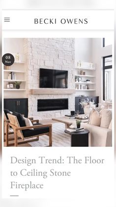 a living room with white brick fireplaces and black furniture in the center is an advertisement for design trend the floor to ceiling stone fireplace