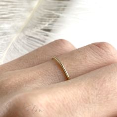 One piece of everyday durable, milgrain stacker ring handcrafted in 14K solid gold. It is the ESSENTIAL ring for your treasure box. Ships within 3 business days. - Band width: 1.1mm - Band thickness: 1.3mm - Made in 14 karat gold. - Stamp with 14K. Classic Everyday Stackable Toe Rings, Classic Adjustable Stackable Rings, Tiny Adjustable Classic Stackable Rings, Classic Tiny Toe Rings, Tiny Classic Midi Rings For Everyday, Classic Tiny Midi Rings For Everyday, Minimalist 14k Gold Ring With Decorative Band, Classic Tiny Stackable Rings For Gift, Classic Tiny Stackable Rings As Gift