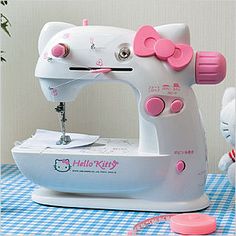 a hello kitty sewing machine sitting on top of a table