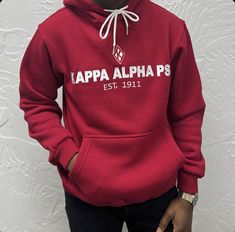 This Kappa Alpha Psi red floating K Premium hoodie is a must-have for any fraternity member looking for a stylish and comfortable addition to their wardrobe. The hoodie features the iconic Kappa Alpha Psi logo on the chest, making it a great way to show your pride in your organization. The hoodie is made of high-quality materials and is designed to provide both comfort and warmth. It is perfect for wearing to events, meetings, or just around campus. With its classic design and comfortable fit, t Red Fleece Hoodie With Double-lined Hood, Casual Red Hoodie With Drawstring Hood, Casual Red Fleece Hoodie, Red Fleece Hoodie With Letter Print, University Red Fleece Casual Sweatshirt, University Red Casual Hooded Hoodie, Casual University Red Hooded Hoodie, Casual Red Hoodie With Double-lined Hood, Red Casual Hoodie With Double-lined Hood