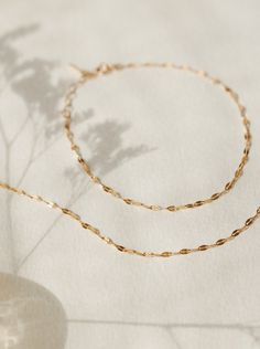 Light up your bracelet stack with a glowing string of solid gold: a high-shine staple you can put on…and leave on forever. Available in an adjustable 6.25-7.25" length or a custom length to fit any wrist! 10k solid gold is:- more durable and scratch-resistant than 14k- made for a lifetime of 24/7 wear- nearly indistinguishable from 14k in color and shine- able to be polished and refinished indefinitely- waterproof and sweat-proof—just no chemicals, please! We even wrote a journal about why 10k i Adjustable 14k Gold-filled Paperclip Chain Bracelet, Adjustable 14k Gold-filled Paperclip Bracelet With Delicate Chain, Dainty Adjustable 14k Gold Paperclip Bracelet, Adjustable Figaro Chain Bracelet For Gift, Adjustable Figaro Chain Bracelet As Gift, Hypoallergenic Adjustable Link Jewelry, Adjustable Gold Plated Figaro Chain Jewelry, Adjustable Gold-plated Figaro Chain Jewelry, Adjustable Gold Figaro Chain Bracelet