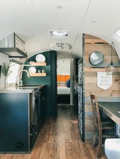 the interior of an rv is clean and ready to be used as a dining area