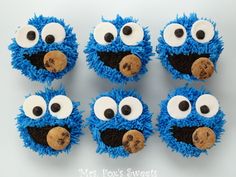 blue cupcakes with googly eyes and chocolate chip cookies in the shape of cookie monster