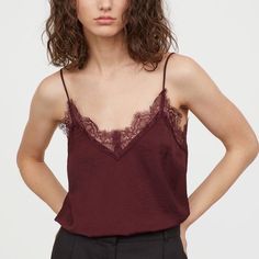 V-Neck Satin Camisole Top From H&M Condition: Like New/Includes Original Tag Color: Burgundy Material: Satin Composition: Lace: Polyamide 100%, Polyester 100% Lace Trim At Upper Edge. Skinny Shoulder Straps. Unlined. Length (Top Of Shoulder Strap To Bottom): ~26” Bust: ~36” Black Silk Camisole, White Camisole Top, Sheer Black Shirt, Silk Cami Top, Textured Tank Top, Small Tank Tops, Satin Camisole, Sparkly Top, Sheer Tank Top