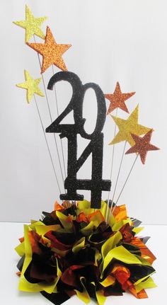 a black and gold star decoration with the number twenty four on it's centerpiece